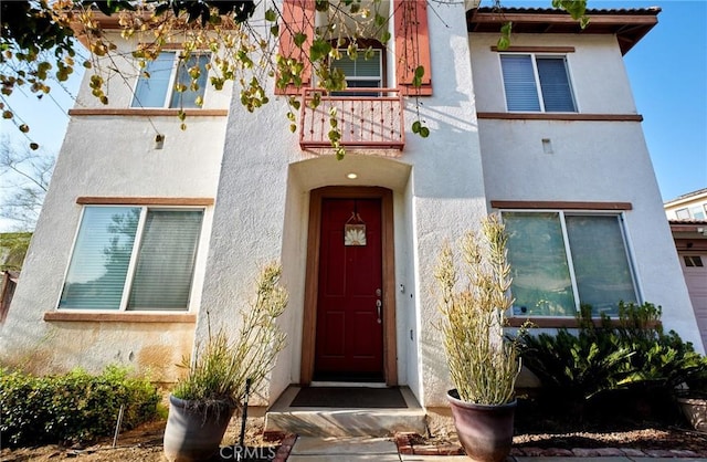 property entrance with a balcony