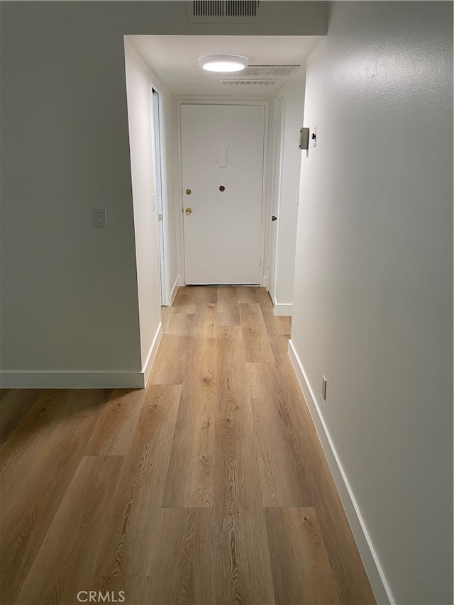 corridor featuring light wood-type flooring