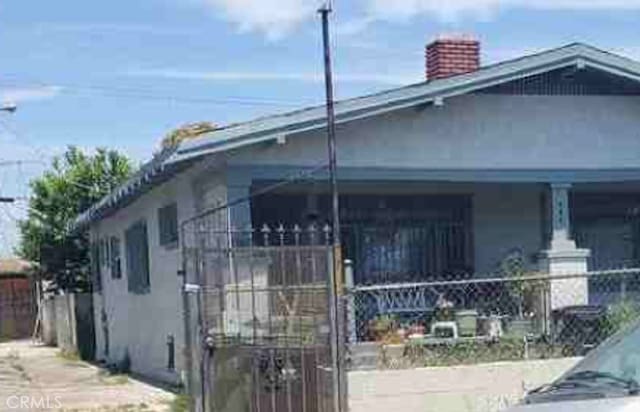 view of property exterior featuring a porch