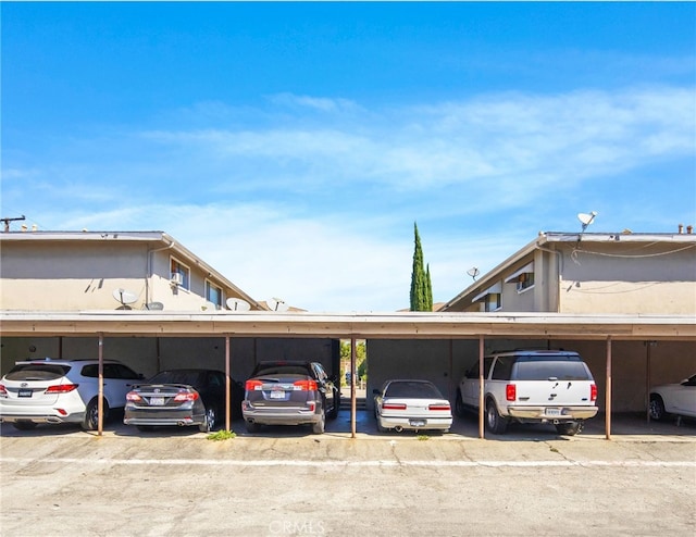 view of vehicle parking with a carport