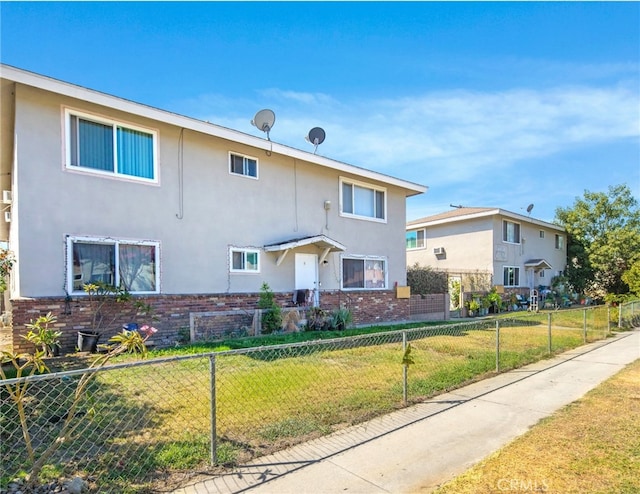 view of front of home featuring a front lawn