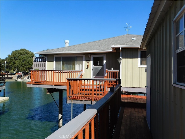 wooden deck with a water view