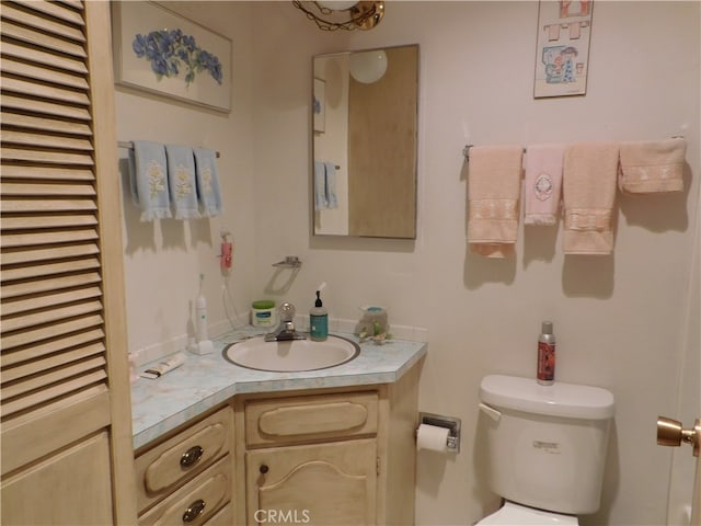 bathroom with toilet and vanity