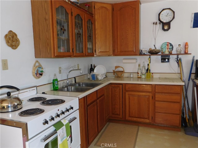 kitchen with sink and electric range