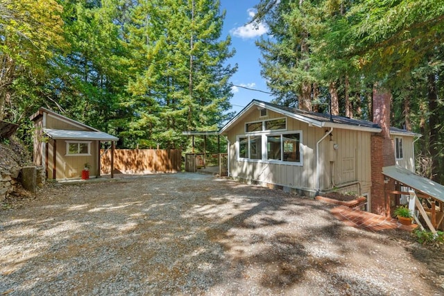 view of home's exterior with a storage unit