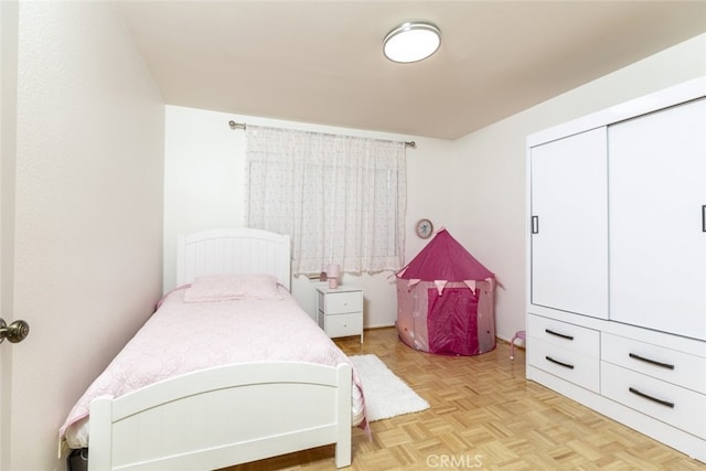 bedroom featuring light parquet floors