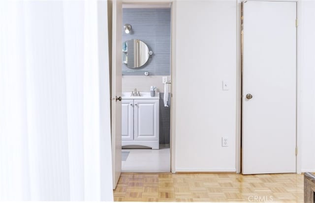 bathroom featuring vanity and parquet floors