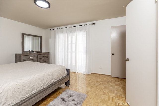 bedroom featuring light parquet flooring