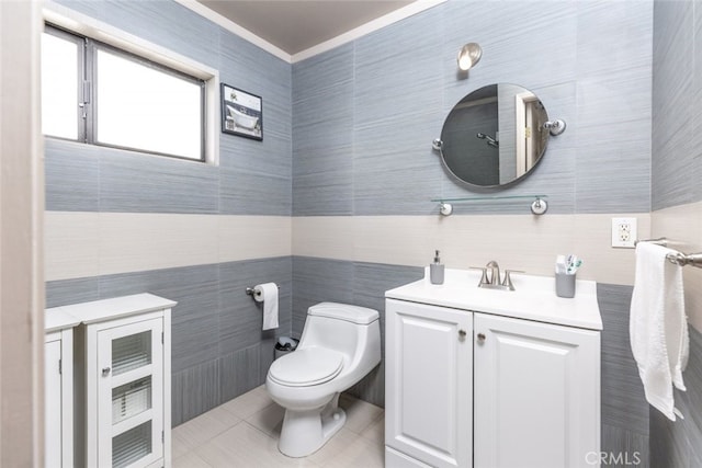 bathroom featuring tile patterned floors, vanity, and toilet