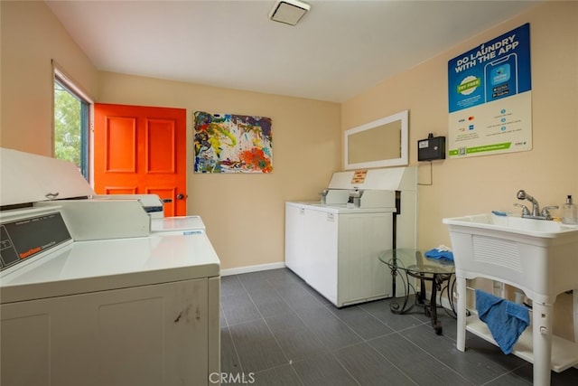 laundry room with separate washer and dryer