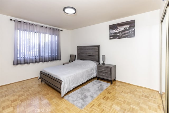 bedroom featuring light parquet floors