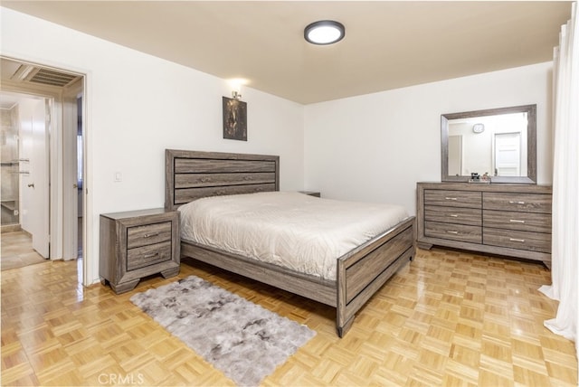 bedroom featuring light parquet flooring