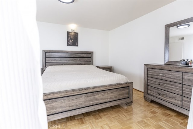 bedroom featuring light parquet floors