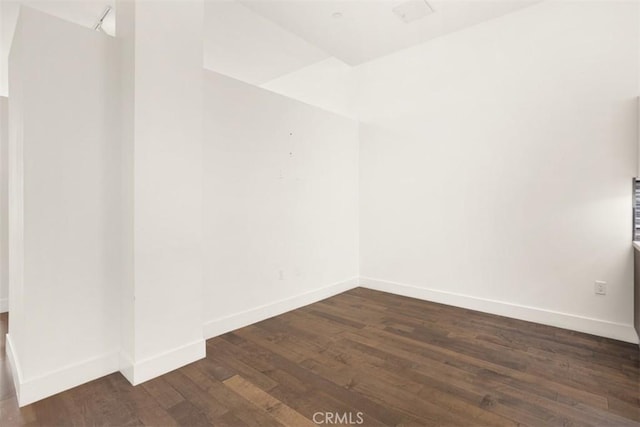 433 Pine Ave Unit 304, Long Beach, CA 90802 - spare room with dark wood finished floors and baseboards