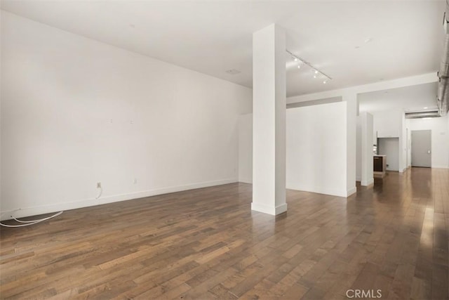 433 Pine Ave Unit 304, Long Beach, CA 90802 - basement with track lighting, dark wood-style floors, and baseboards