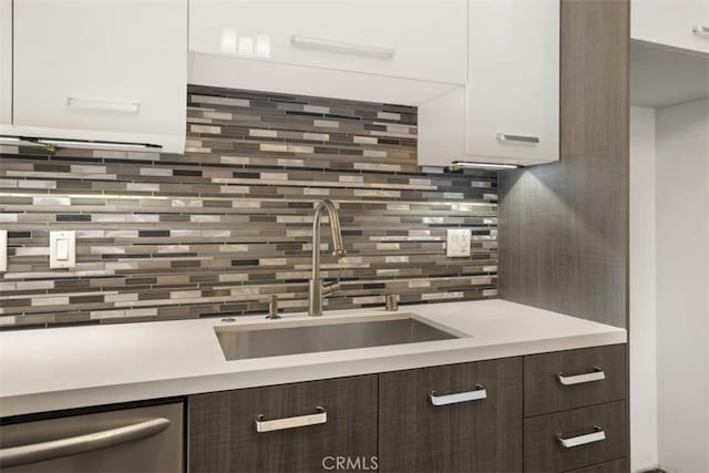 433 Pine Ave Unit 304, Long Beach, CA 90802 - kitchen with dark brown cabinetry, a sink, light countertops, modern cabinets, and white cabinets