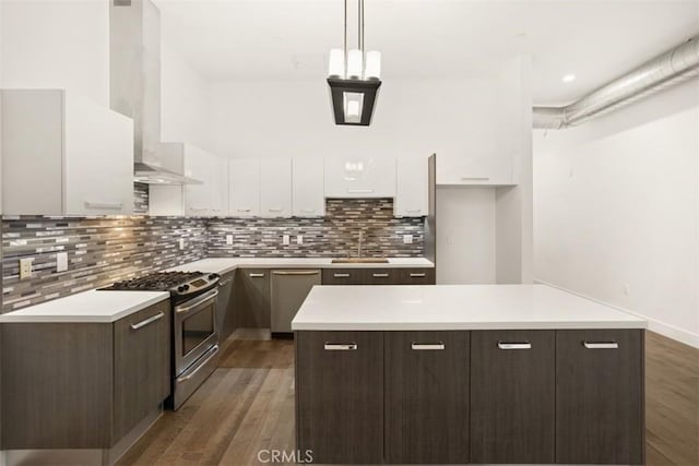 433 Pine Ave Unit 304, Long Beach, CA 90802 - kitchen featuring stainless steel appliances, modern cabinets, white cabinets, dark brown cabinets, and a kitchen island