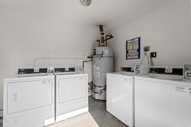 laundry room featuring secured water heater and separate washer and dryer