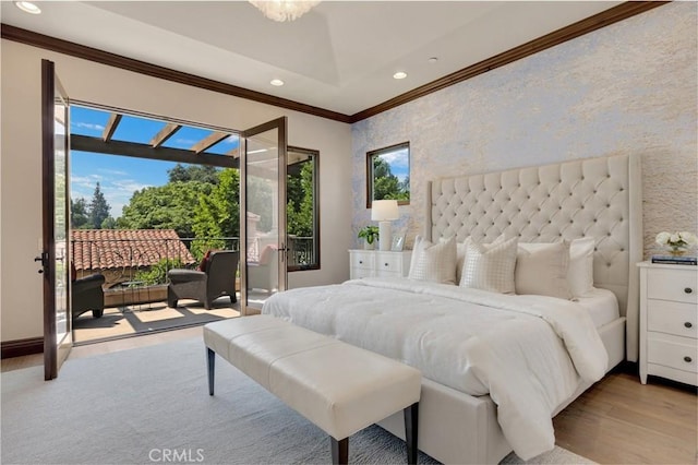 bedroom featuring access to outside, light hardwood / wood-style floors, and ornamental molding