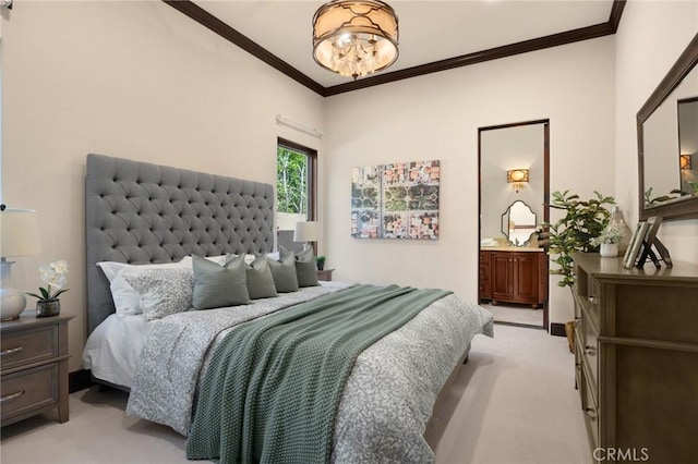 carpeted bedroom with ornamental molding, connected bathroom, and an inviting chandelier