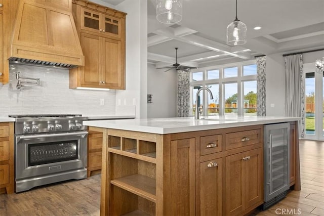 kitchen with coffered ceiling, wine cooler, light hardwood / wood-style floors, high end range, and custom range hood