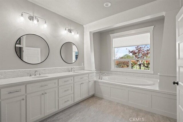 bathroom with a bathtub and vanity