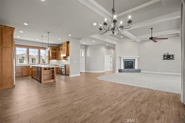 living room with ceiling fan with notable chandelier, light hardwood / wood-style flooring, ornamental molding, a fireplace, and beam ceiling