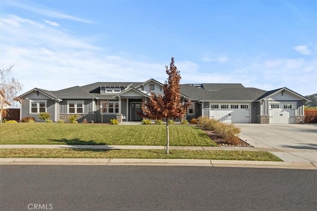 view of front facade with a garage and a front lawn