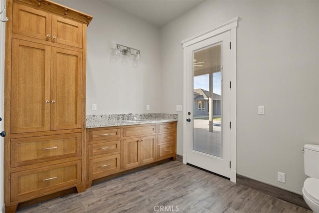 interior space with light hardwood / wood-style floors and sink