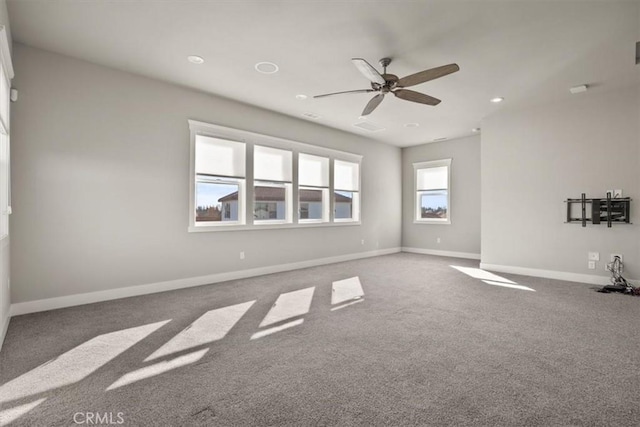 empty room featuring carpet floors and ceiling fan