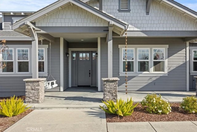 property entrance with covered porch