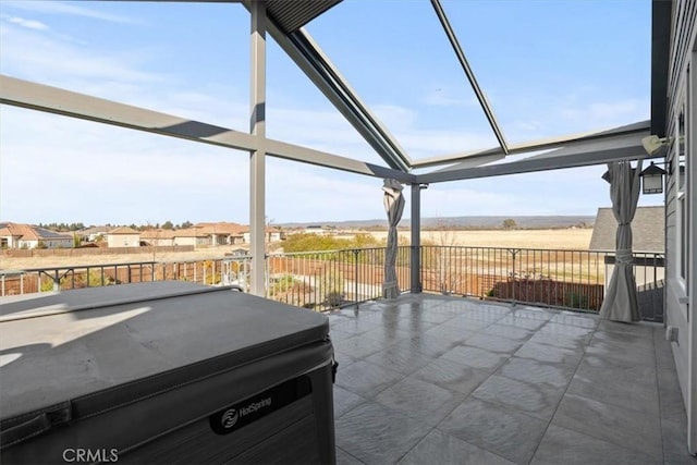 view of patio / terrace with a hot tub