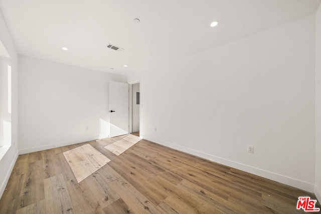 unfurnished room featuring light wood-type flooring