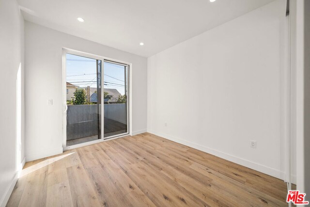 unfurnished room featuring light hardwood / wood-style floors