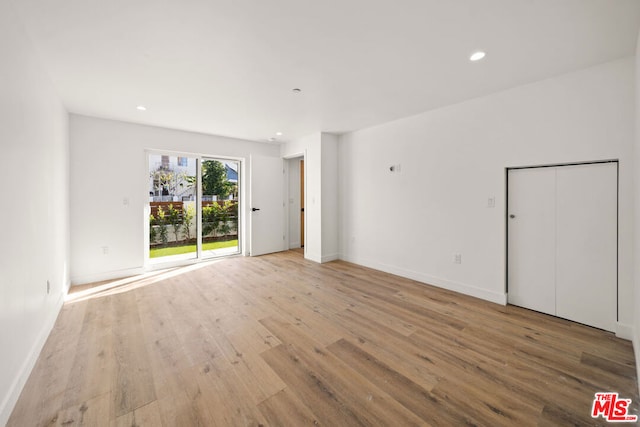 unfurnished room featuring light hardwood / wood-style floors