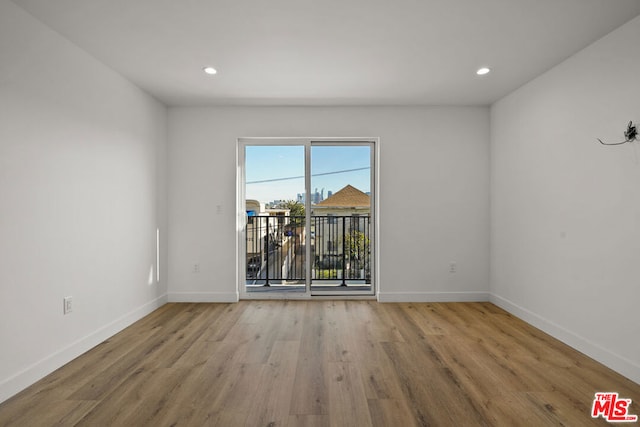 empty room with light wood-type flooring