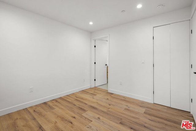 unfurnished bedroom with light hardwood / wood-style flooring