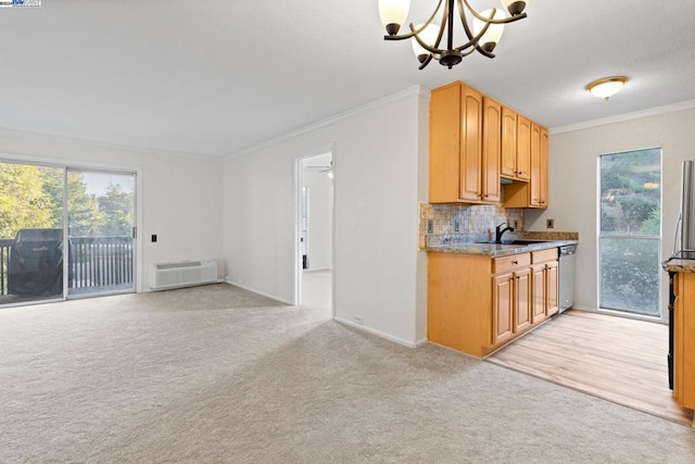 kitchen with dishwasher, light carpet, an AC wall unit, crown molding, and decorative backsplash