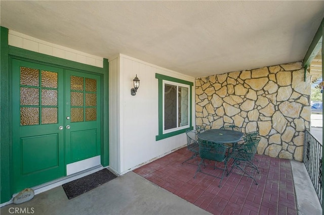 view of exterior entry featuring a porch