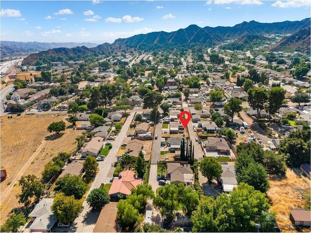 birds eye view of property with a mountain view