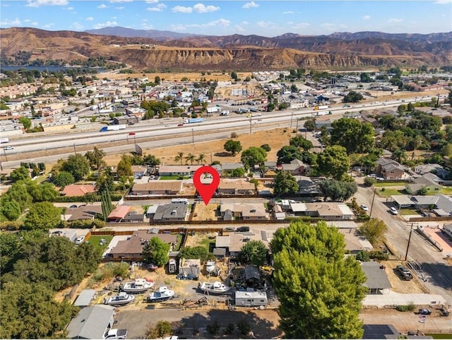 birds eye view of property featuring a mountain view