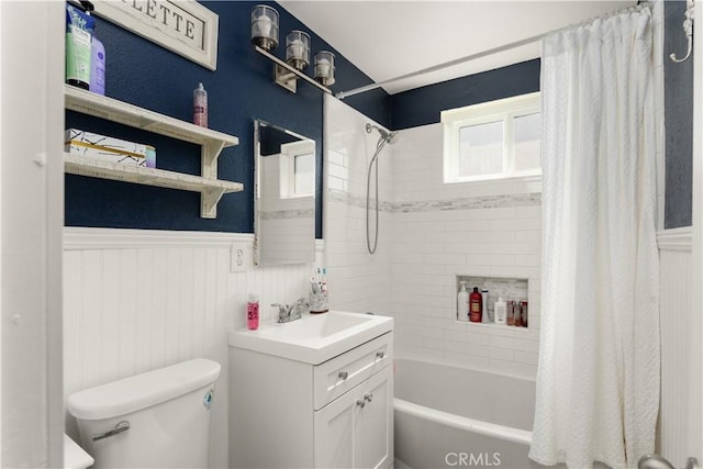 full bathroom with shower / bath combination with curtain, vanity, and toilet