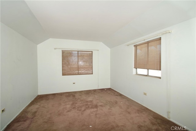 bonus room featuring carpet floors and vaulted ceiling