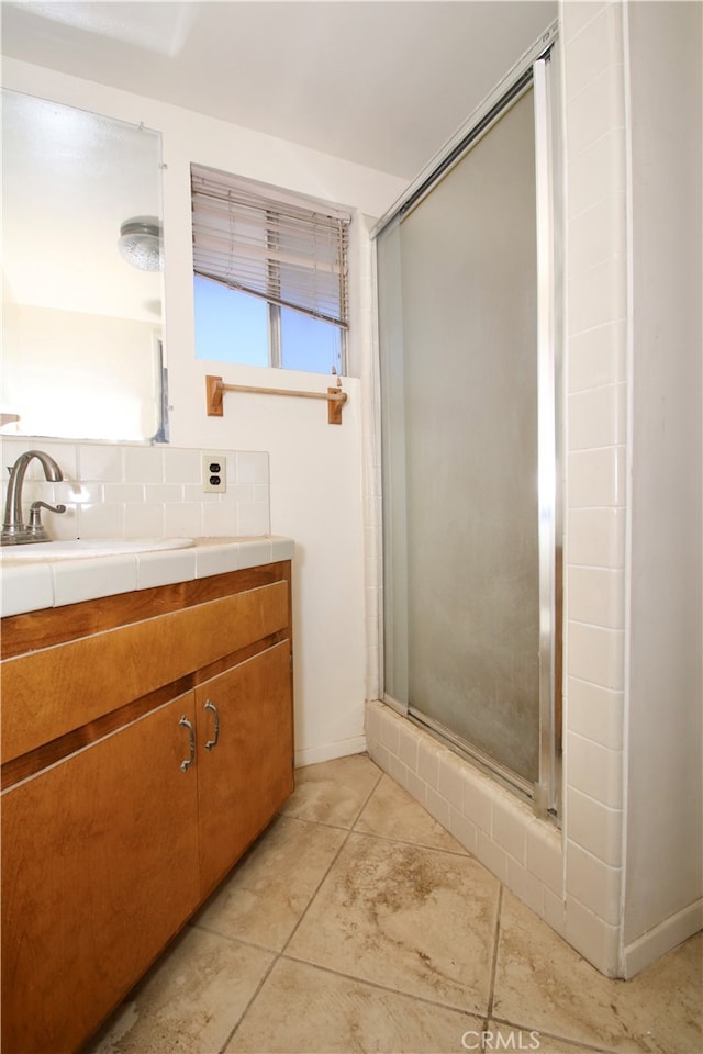 bathroom with vanity, tile patterned floors, and an enclosed shower