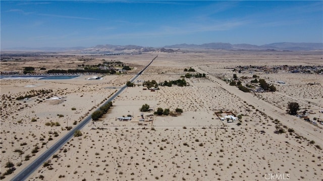 birds eye view of property featuring a mountain view