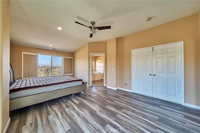 bedroom with wood-type flooring, a closet, ensuite bath, and ceiling fan