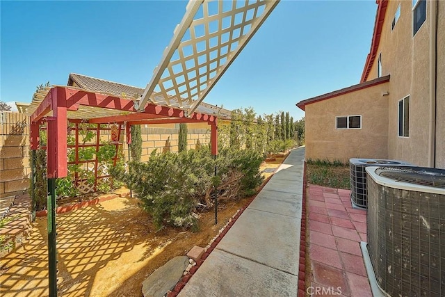 view of patio with a pergola and central AC unit