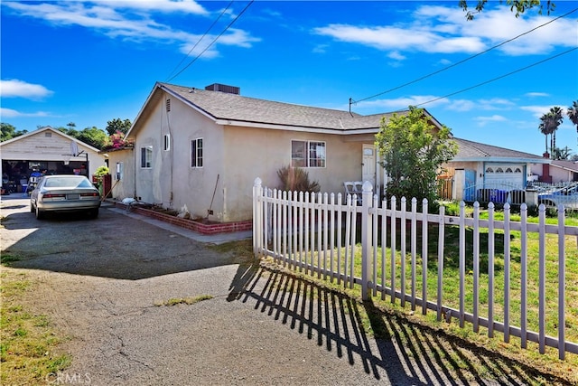 view of front of property with a garage and a front lawn