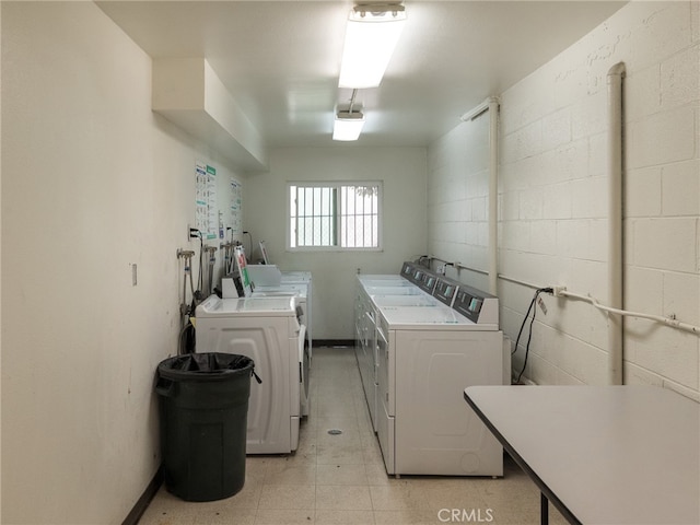 washroom with washing machine and dryer