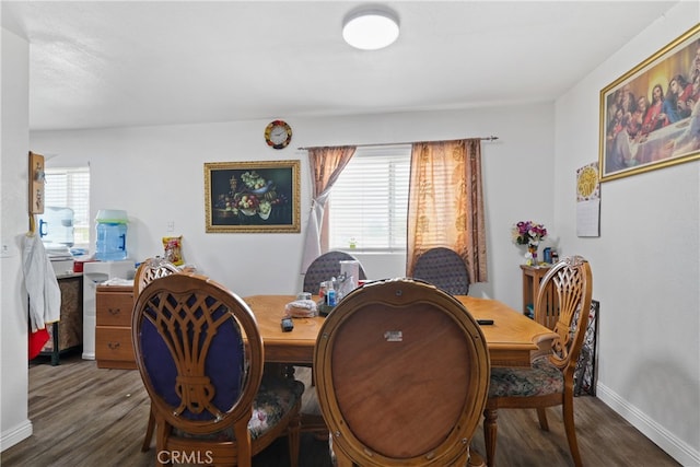 dining area with dark hardwood / wood-style floors